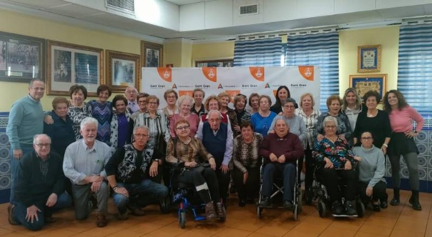 Asistentes a la comida del programa Et motivem