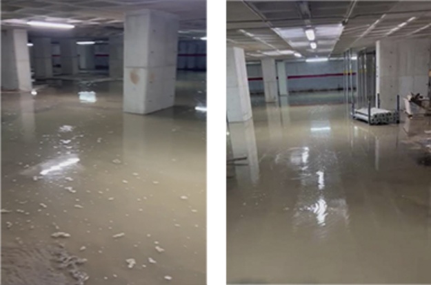 Foto de l'aparcament de la Rosaleda inundat per la pluja